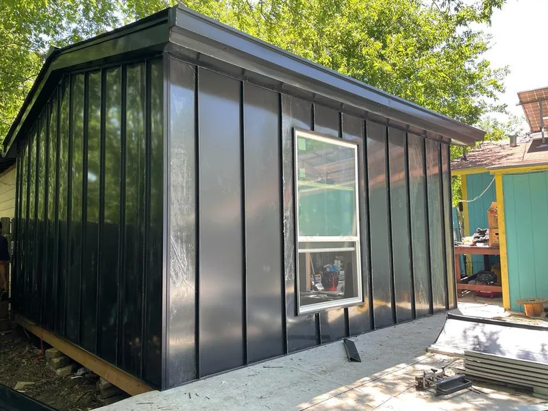 Black standing seam metal wall panels for Metal Roof Installation in Montevideo